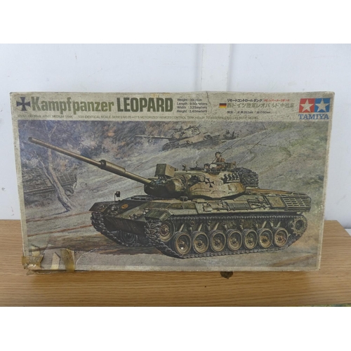 1068 - A vintage Tamiya Kamp F Panzer Leopard Kit box and a vintage Pontoon Bridge Assault Set box with som... 