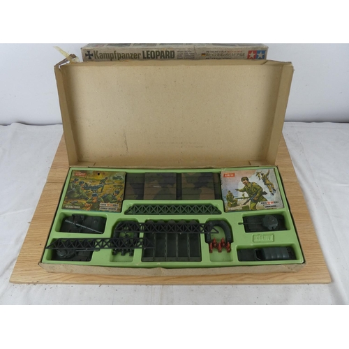 1068 - A vintage Tamiya Kamp F Panzer Leopard Kit box and a vintage Pontoon Bridge Assault Set box with som... 