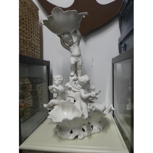 1092 - A large ceramic white cherub centrepiece with repairs, measuring 60cm in height.