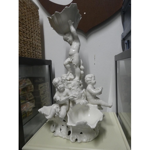 1092 - A large ceramic white cherub centrepiece with repairs, measuring 60cm in height.