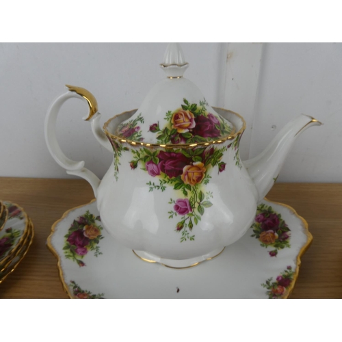 1098 - A Royal Albert Old Country Rose tea set to include teapot, milk jug and sugar bowl and more.