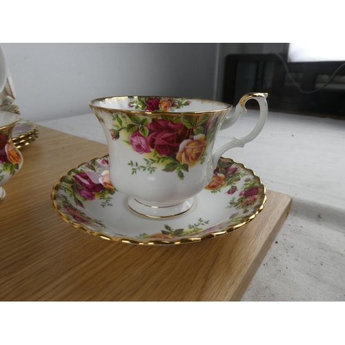 1098 - A Royal Albert Old Country Rose tea set to include teapot, milk jug and sugar bowl and more.