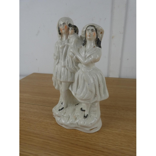 1111 - An antique Staffordshire figure,