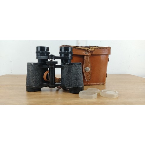 84 - A pair of vintage Orbit 8 X 30 binoculars and leather case.