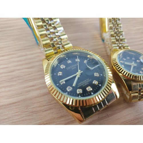 358 - A Dedima ladies and gents wrist watch set.