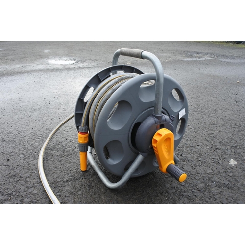 1130 - A garden hose and reel.