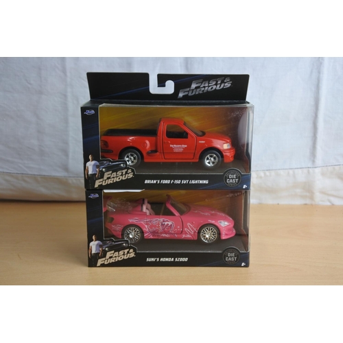 119 - Two boxed Jada 'Fast & Furious' die cast cars - Brian's Ford F-150 SVT Lightning and Suki's Honda SZ... 