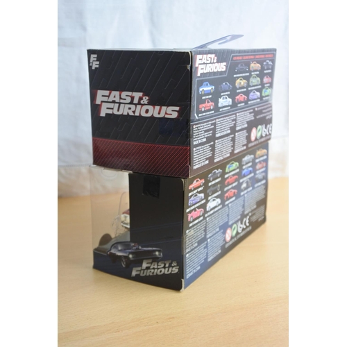 129 - Two boxed Jada 'Fast & Furious' die cast cars - Dom's Chevy Impala and Brian's Nissan Skyline GT-R (... 