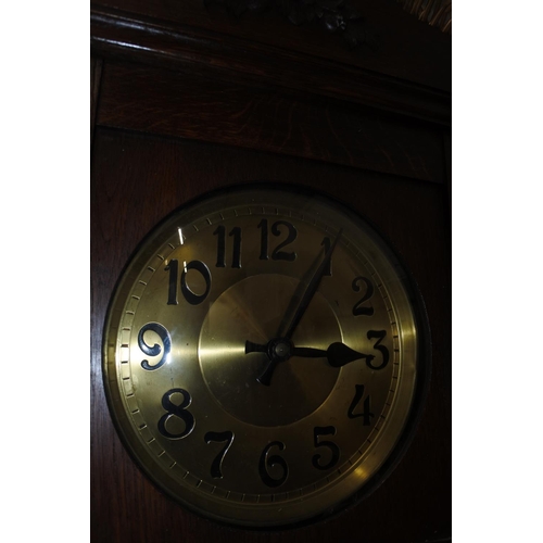 142 - A stunning large antique oak cased grandfather clock. Measuring H-215 W-47cm D-25cm.