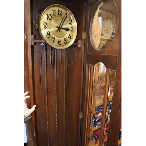 142 - A stunning large antique oak cased grandfather clock. Measuring H-215 W-47cm D-25cm.