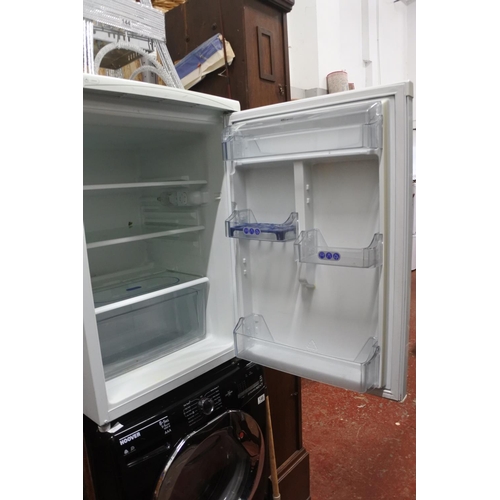 145 - A Whirlpool under counter fridge. Measuring H-83cm W-54cm D-64cm.