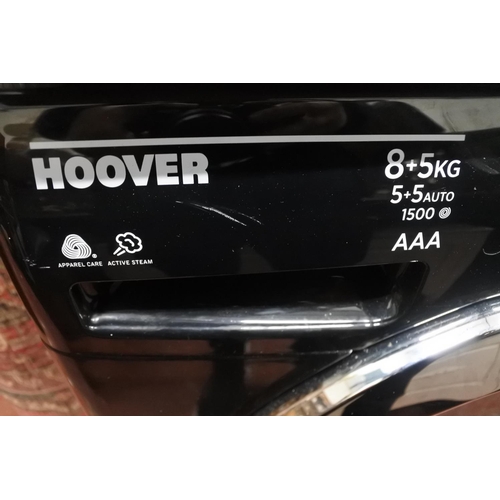 146 - A Hoover washing machine. Measuring H-86cm W-60cm D-53cm