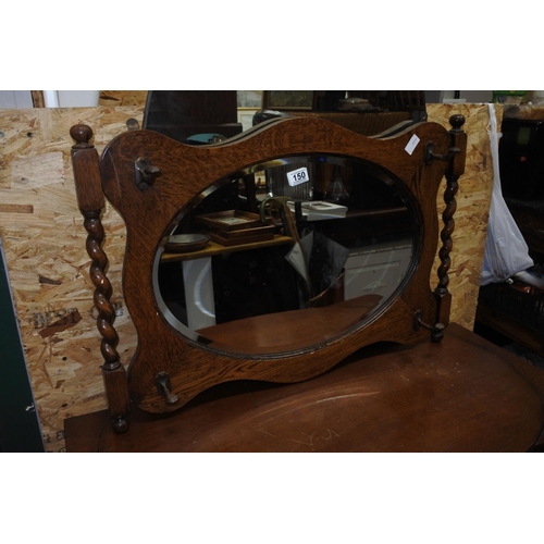 150 - A stunning oak hall mirror with hooks. Measuring H-55cm W-82cm.