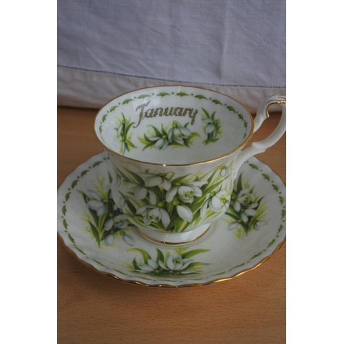 188 - A Royal Albert bone china 'January' cup and saucer and a Rosina China 'May' cup and saucer and a han... 