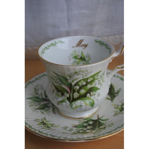 188 - A Royal Albert bone china 'January' cup and saucer and a Rosina China 'May' cup and saucer and a han... 