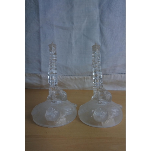 21 - A pair of ornamental glass seahorses.