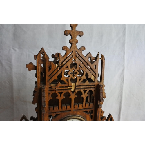 70 - A stunning mahogany carved mantle clock (a/f), measuring 34cm tall.