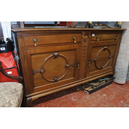 82 - A stunning antique mahogany sideboard with carved detail. Measuring H-100cm W-165cm D-60cm.