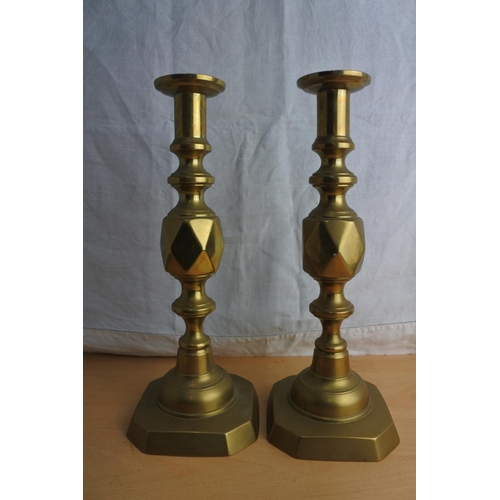 91 - A stunning pair of antique brass candlesticks stamped 'The King of Diamonds'.