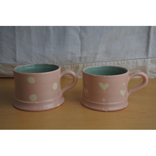 107 - Two Gabriella Miller pink patterned cups.