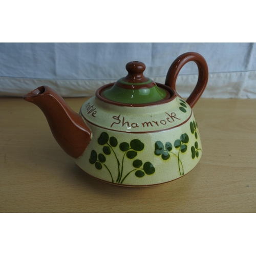 108 - A vintage terracotta shamrock patterned teapot (a/f).