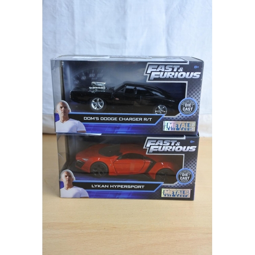 112 - Two Jada 'Fast & Furious' die cast cars - Dom's Dodge Charger R/T and Lykan Hypersport.