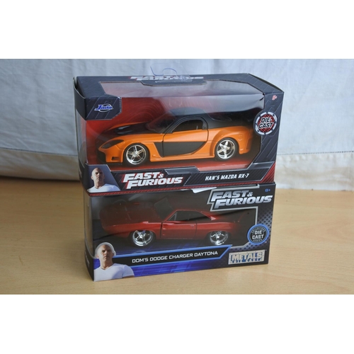 122 - Two boxed Jada 'Fast & Furious' die cast cars - Han's Mazda RX-7 and Dom's Dodge Charger Daytona.