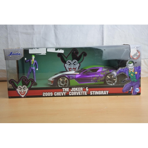 137 - A boxed Jada 'The Joker' die cast car and figure - 2009 Chevy Corvette Stingray.