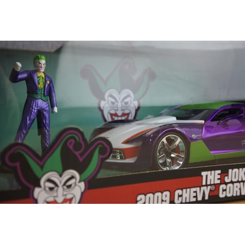 137 - A boxed Jada 'The Joker' die cast car and figure - 2009 Chevy Corvette Stingray.