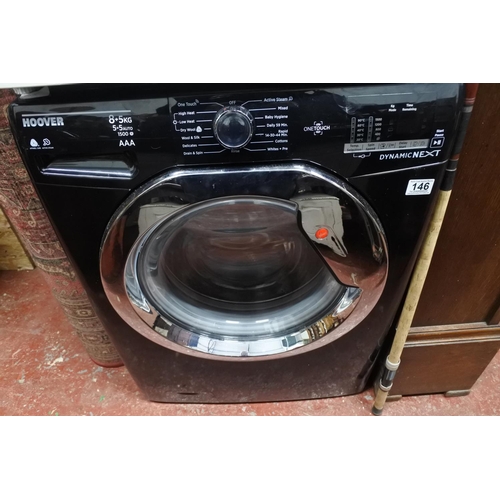 146 - A Hoover washing machine. Measuring H-86cm W-60cm D-53cm