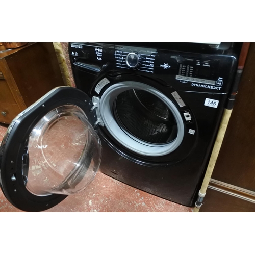 146 - A Hoover washing machine. Measuring H-86cm W-60cm D-53cm