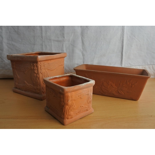 164 - A collection of small terracotta plant pots.