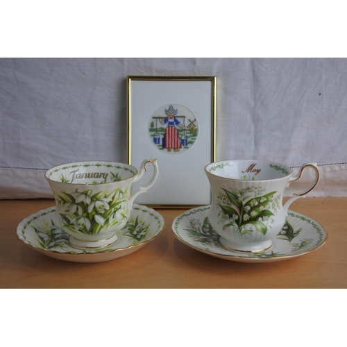 188 - A Royal Albert bone china 'January' cup and saucer and a Rosina China 'May' cup and saucer and a han... 