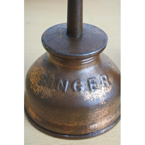 197 - A vintage Singer oil can & 2 bells.