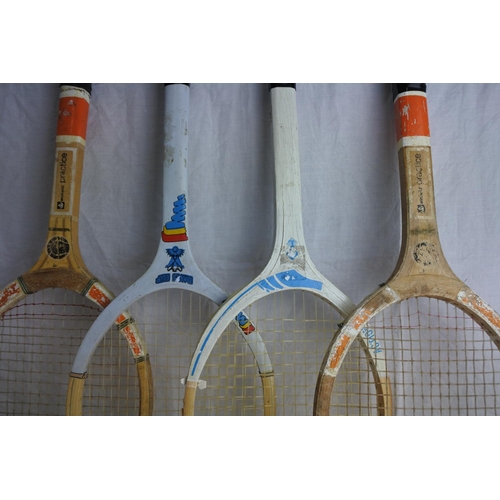 214 - 4 vintage wooden tennis racquets.