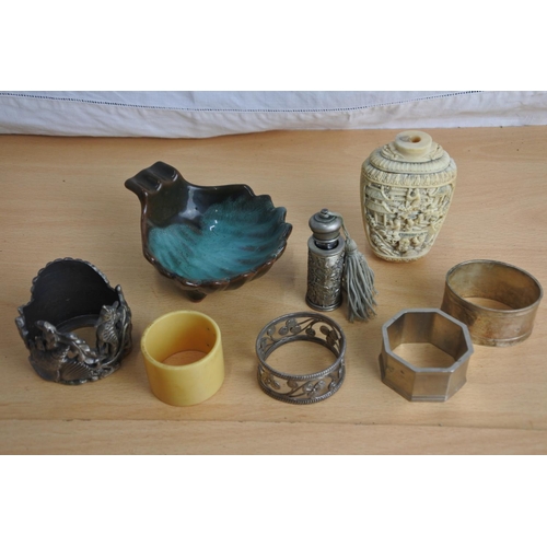 227 - An assortment of various items to include napkin rings, Oriental pieces & more.