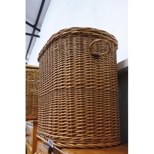 250 - A large wicker linen basket. Measuring H-50cm W-50cm D-26cm