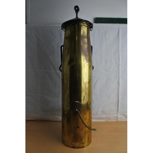 63 - An unusual table lamp made from a shell case. Measuring H-60cm.