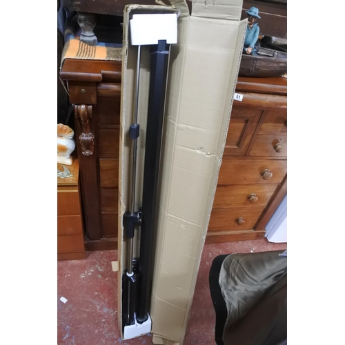 68 - A boxed projector screen, measuring 50