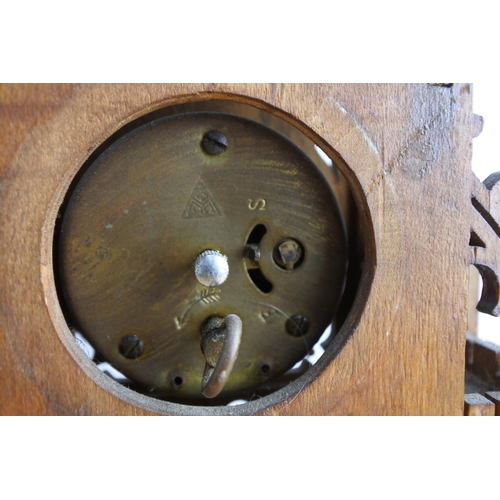 70 - A stunning mahogany carved mantle clock (a/f), measuring 34cm tall.