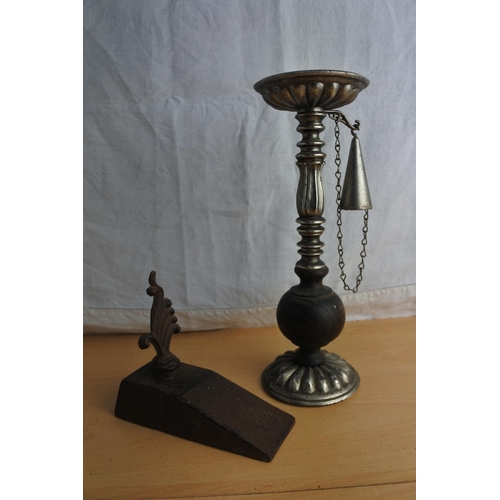 89 - A door stop and a wooden and metal candlestick and snuffer.