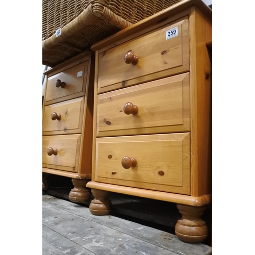 259 - A pair of pine three drawer cabinets.