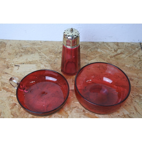 292 - Three pieces of antique ruby glass ware to include a silver plated sugar shaker.