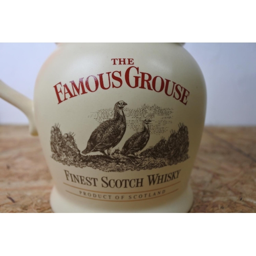 296 - A Wade 'The Famous Grouse' scotch whiskey jug.