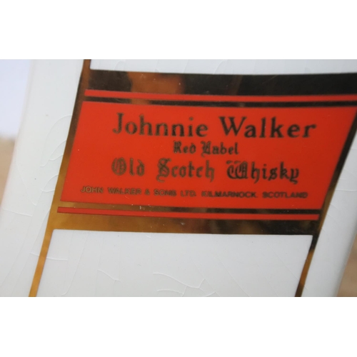 297 - A Seaton 'Johnnie Walker' scotch whiskey jug.