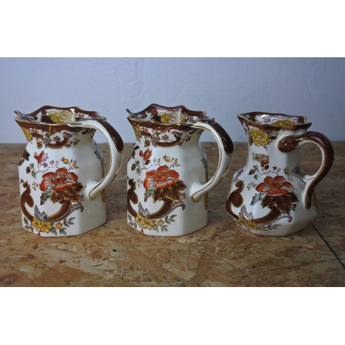 301 - A set of three Mason's Ironestone 'Brown Velvet' jugs.