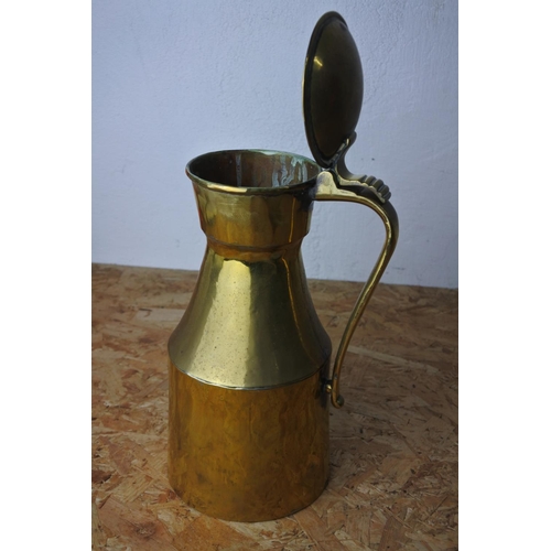 313 - A vintage brass lidded jug.