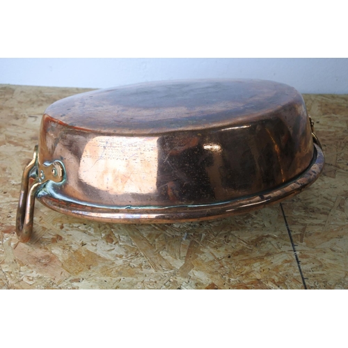 315 - A stunning large antique copper preserving pan. (measures 35cm wide, not including handles).