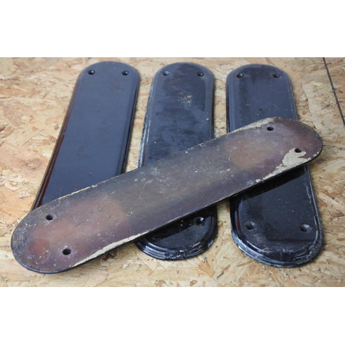 318 - A set of four vintage black painted door handle protectors.