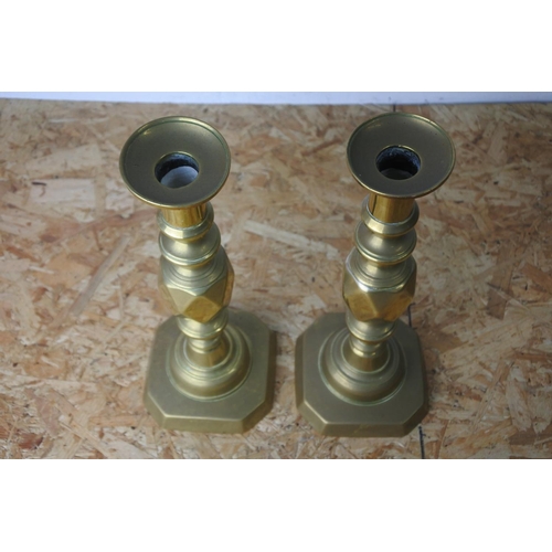 319 - A stunning pair of 'The Kings Diamond' brass candlesticks.